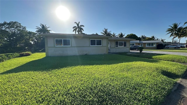 1701 NW 10th Ave, Fort Lauderdale, FL 33311 - ranch-style home with a front lawn and stucco siding