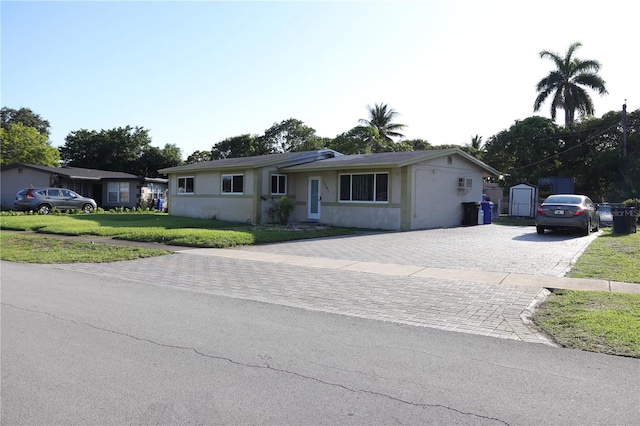 1701 NW 10th Ave, Fort Lauderdale, FL 33311 - single story home featuring decorative driveway, a front lawn, and stucco siding
