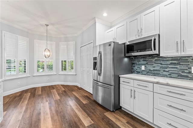 137 Silver Falls Dr, Apollo Beach, FL 33572 - kitchen with appliances with stainless steel finishes, a chandelier, healthy amount of natural light, backsplash, and ornamental molding