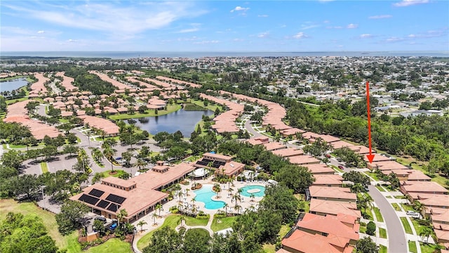 137 Silver Falls Dr, Apollo Beach, FL 33572 - aerial perspective of suburban area with a large body of water and a pool area