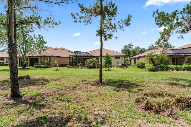 137 Silver Falls Dr, Apollo Beach, FL 33572 - view of green lawn with a lanai
