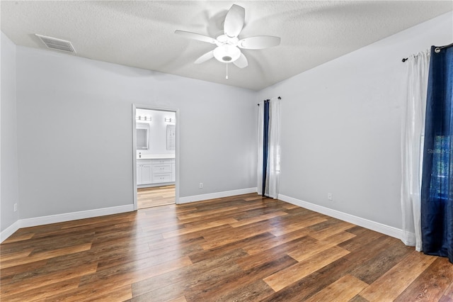 137 Silver Falls Dr, Apollo Beach, FL 33572 - empty room with wood finished floors, a textured ceiling, a ceiling fan, and baseboards