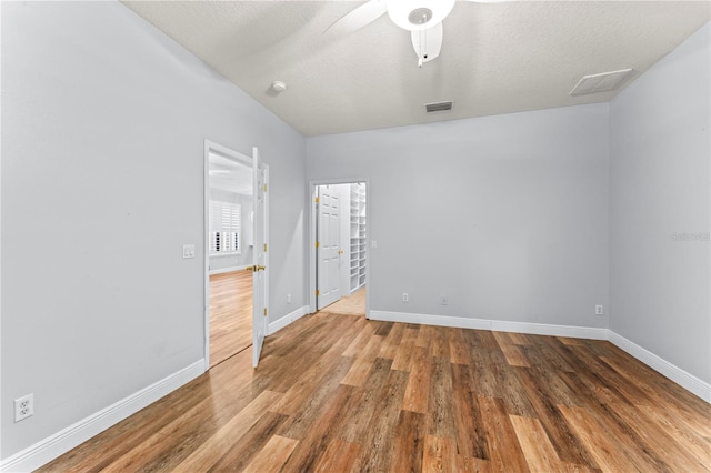 137 Silver Falls Dr, Apollo Beach, FL 33572 - empty room featuring wood finished floors, baseboards, and a ceiling fan