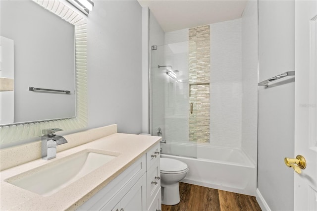137 Silver Falls Dr, Apollo Beach, FL 33572 - bathroom featuring toilet, vanity, wood finished floors, and tub / shower combination