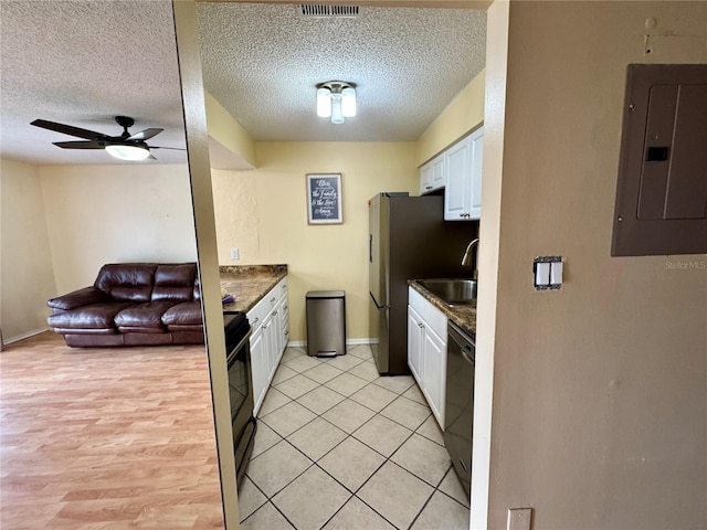 4215 E Bay Dr Unit 1707C, Clearwater, FL 33764 - kitchen featuring electric panel, dishwasher, electric range oven, open floor plan, and white cabinets
