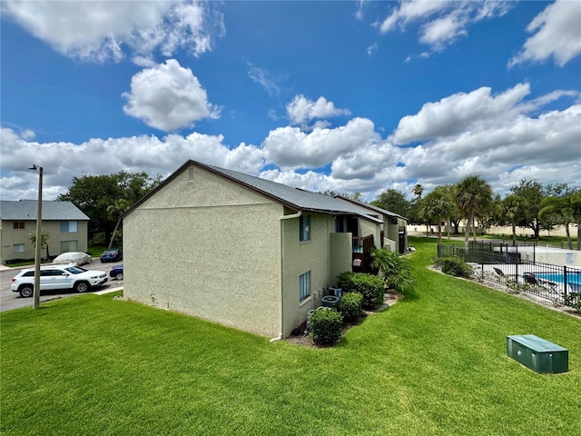 4215 E Bay Dr Unit 1707C, Clearwater, FL 33764 - view of property exterior with stucco siding