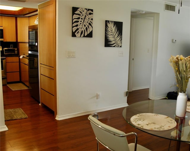 2737 Enterprise Rd E Unit 192, Clearwater, FL 33759 - dining room with dark wood-style floors and baseboards