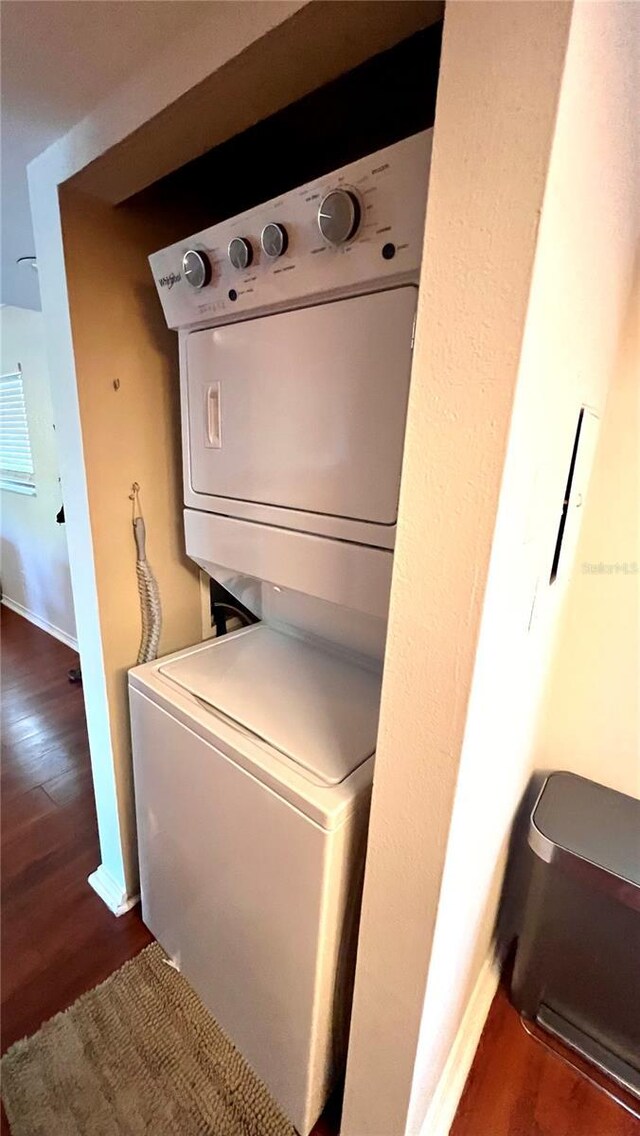2737 Enterprise Rd E Unit 192, Clearwater, FL 33759 - laundry area featuring estacked washer and dryer, wood finished floors, and baseboards
