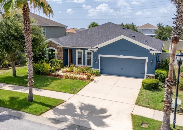 11038 Spring Point Cir, Riverview, FL 33579 - view of front of property featuring an attached garage, a front yard, a shingled roof, and driveway