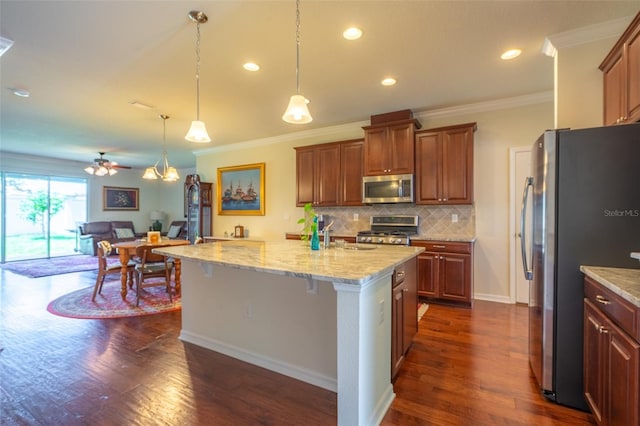 11038 Spring Point Cir, Riverview, FL 33579 - kitchen featuring stainless steel appliances, open floor plan, tasteful backsplash, dark wood-style flooring, and ornamental molding
