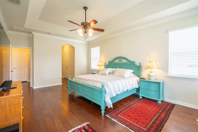 11038 Spring Point Cir, Riverview, FL 33579 - bedroom with a tray ceiling, wood finished floors, arched walkways, ornamental molding, and ceiling fan
