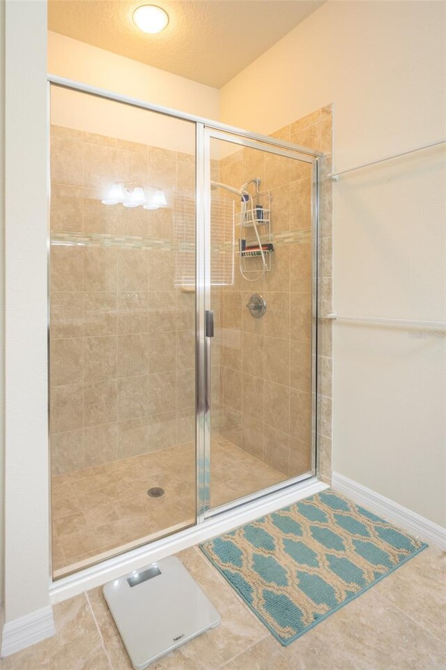 11038 Spring Point Cir, Riverview, FL 33579 - bathroom featuring a stall shower and tile patterned floors