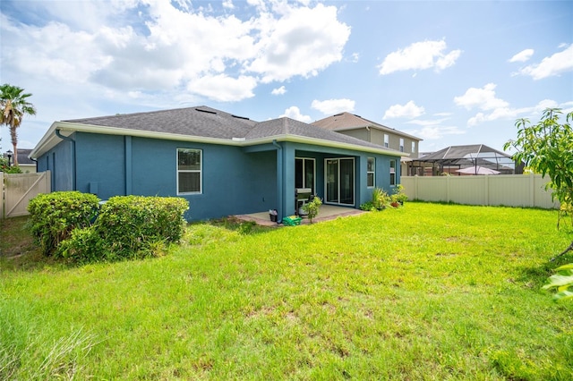 11038 Spring Point Cir, Riverview, FL 33579 - rear view of house featuring a fenced backyard, stucco siding, and a patio area