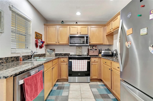 213 Draw Bridge Ln, Valrico, FL 33594 - kitchen with appliances with stainless steel finishes, a sink, light brown cabinets, dark stone countertops, and recessed lighting