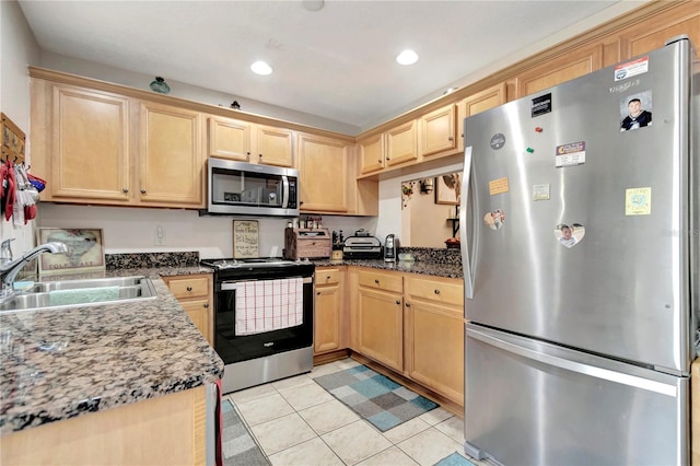 213 Draw Bridge Ln, Valrico, FL 33594 - kitchen featuring appliances with stainless steel finishes, a sink, light tile patterned flooring, light brown cabinets, and recessed lighting