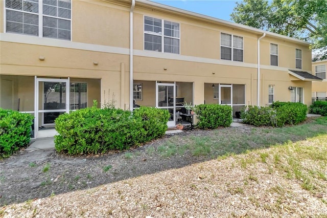 213 Draw Bridge Ln, Valrico, FL 33594 - back of house featuring stucco siding
