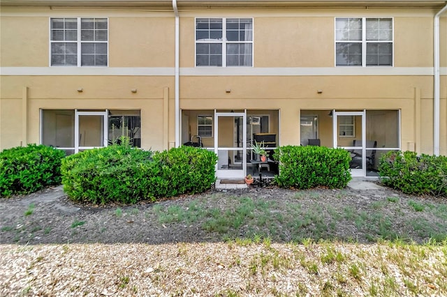 213 Draw Bridge Ln, Valrico, FL 33594 - back of property with stucco siding