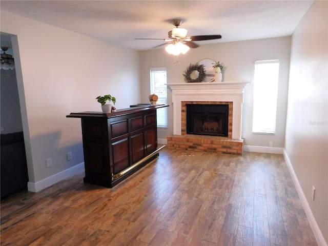15916 Marshfield Dr, Tampa, FL 33624 - living room featuring ceiling fan, wood finished floors, and a fireplace