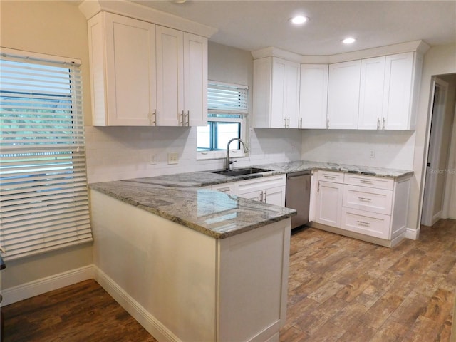15916 Marshfield Dr, Tampa, FL 33624 - kitchen featuring stainless steel dishwasher, white cabinets, a peninsula, and recessed lighting