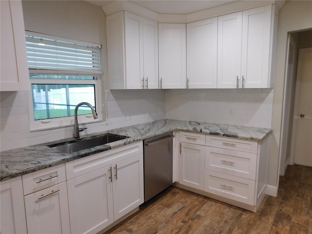 15916 Marshfield Dr, Tampa, FL 33624 - kitchen featuring stainless steel dishwasher, decorative backsplash, white cabinetry, dark wood-style floors, and light stone counters