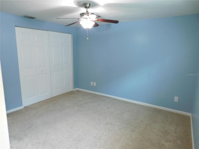15916 Marshfield Dr, Tampa, FL 33624 - unfurnished bedroom featuring a closet, carpet flooring, and ceiling fan