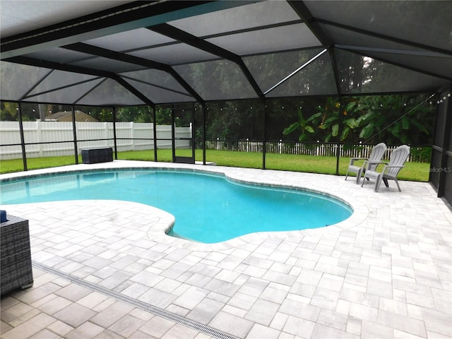 15916 Marshfield Dr, Tampa, FL 33624 - view of swimming pool featuring a patio area, a fenced backyard, and a lanai