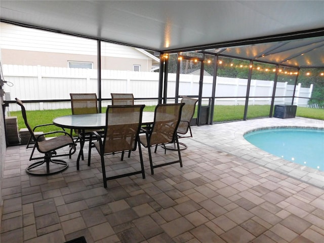 15916 Marshfield Dr, Tampa, FL 33624 - view of swimming pool with a patio area, a fenced backyard, glass enclosure, and outdoor dining space