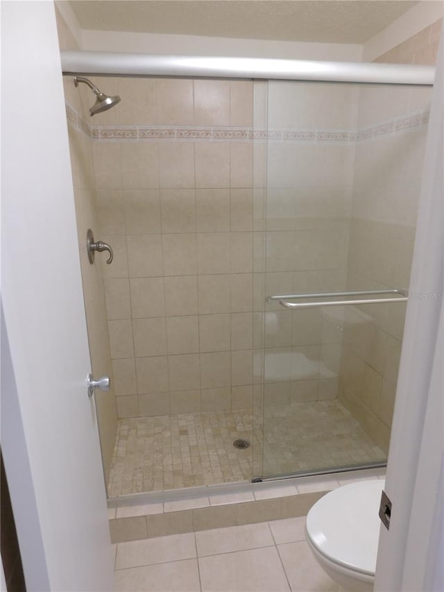 15916 Marshfield Dr, Tampa, FL 33624 - full bath with a stall shower and tile patterned floors