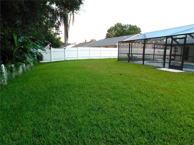 15916 Marshfield Dr, Tampa, FL 33624 - fenced backyard with a patio and a lanai