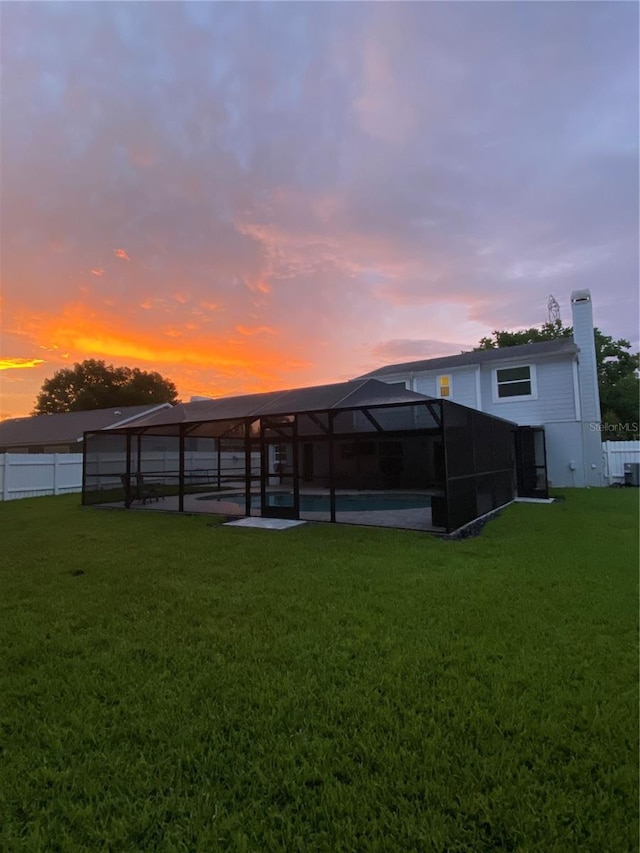 15916 Marshfield Dr, Tampa, FL 33624 - rear view of property with a patio area, glass enclosure, and a chimney
