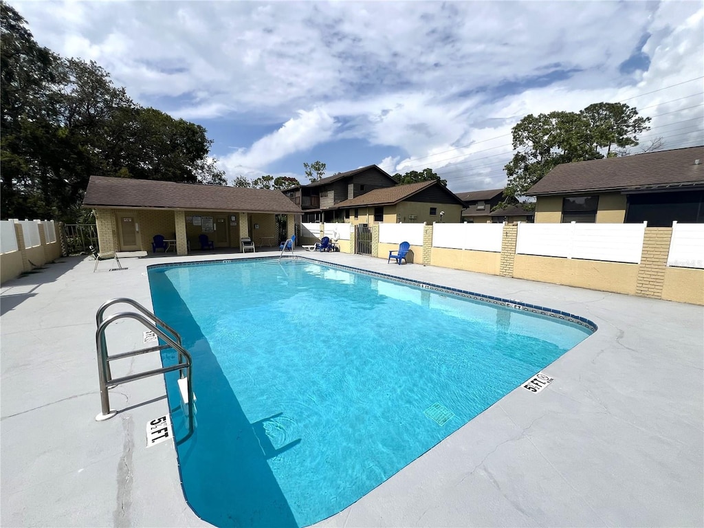 502 E Curlew Pl, Tarpon Springs, FL 34689 - community pool with a patio