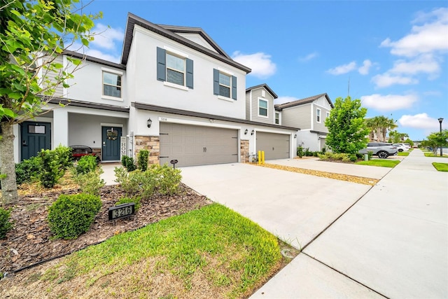 3216 Bryant Park Dr, New Port Richey, FL 34655 - view of front facade with stucco siding, driveway, a garage, and stone siding