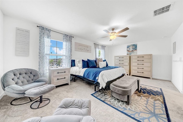 3216 Bryant Park Dr, New Port Richey, FL 34655 - bedroom with light carpet, ceiling fan, and baseboards