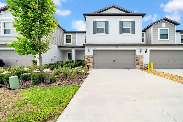 3216 Bryant Park Dr, New Port Richey, FL 34655 - view of front of property featuring stucco siding, an attached garage, stone siding, and driveway