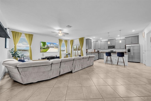 3216 Bryant Park Dr, New Port Richey, FL 34655 - living room with light tile patterned floors, ceiling fan, and recessed lighting