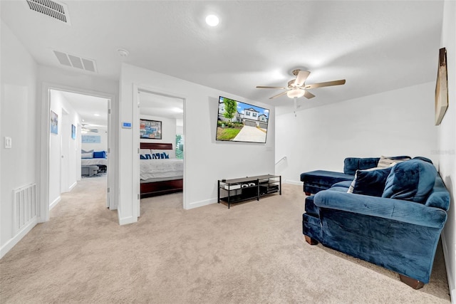3216 Bryant Park Dr, New Port Richey, FL 34655 - living room with a ceiling fan, light carpet, and baseboards