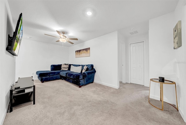 3216 Bryant Park Dr, New Port Richey, FL 34655 - living area featuring carpet, a ceiling fan, and baseboards