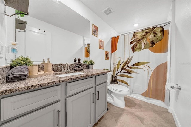 3216 Bryant Park Dr, New Port Richey, FL 34655 - bathroom with vanity, toilet, and tile patterned flooring