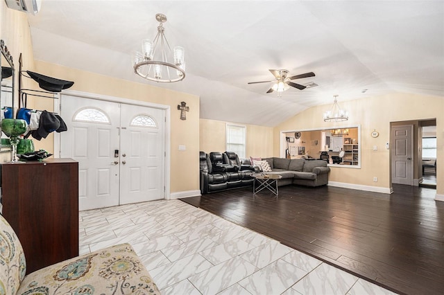 9220 Mcintosh Rd, Dover, FL 33527 - entrance foyer featuring a chandelier, lofted ceiling, ceiling fan, and marble look tiles