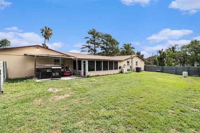 9220 Mcintosh Rd, Dover, FL 33527 - rear view of property featuring a sunroom and stucco siding