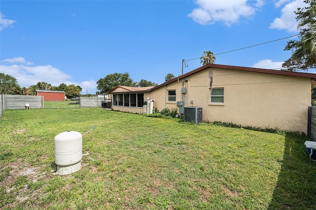 9220 Mcintosh Rd, Dover, FL 33527 - back of house with stucco siding and a sunroom