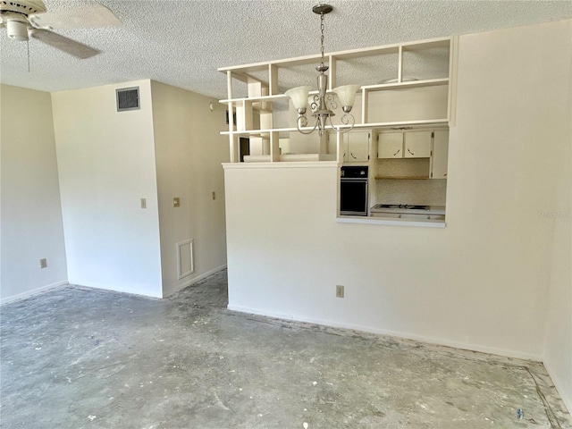 2391 Sumatran Way Unit 37, Clearwater, FL 33763 - empty room with unfinished concrete flooring, a ceiling fan, a chandelier, and a textured ceiling