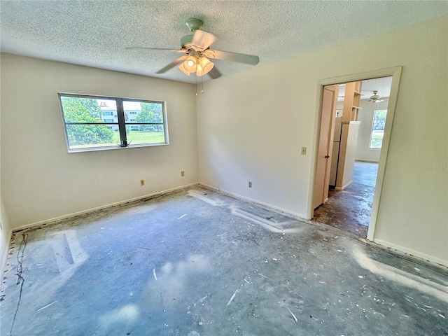 2391 Sumatran Way Unit 37, Clearwater, FL 33763 - unfurnished room featuring ceiling fan and a textured ceiling
