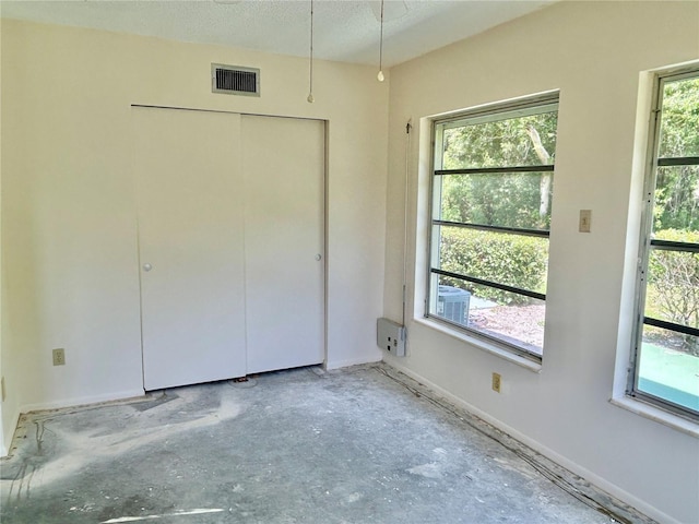 2391 Sumatran Way Unit 37, Clearwater, FL 33763 - unfurnished bedroom with a closet and baseboards