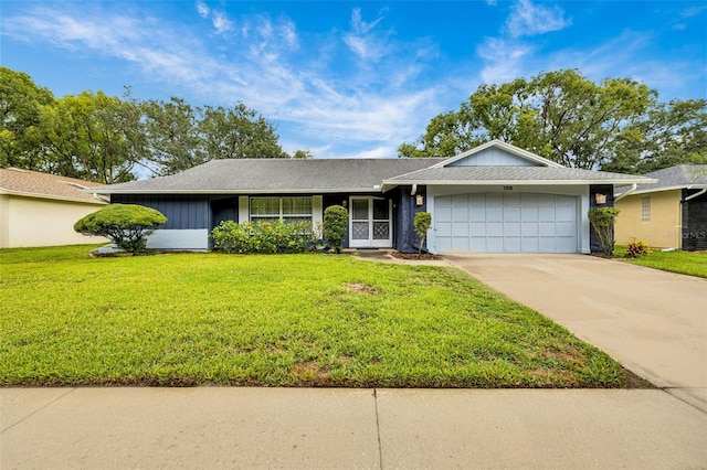 7708 Fairlawn Dr, Hudson, FL 34667 - single story home featuring an attached garage, driveway, and a front lawn