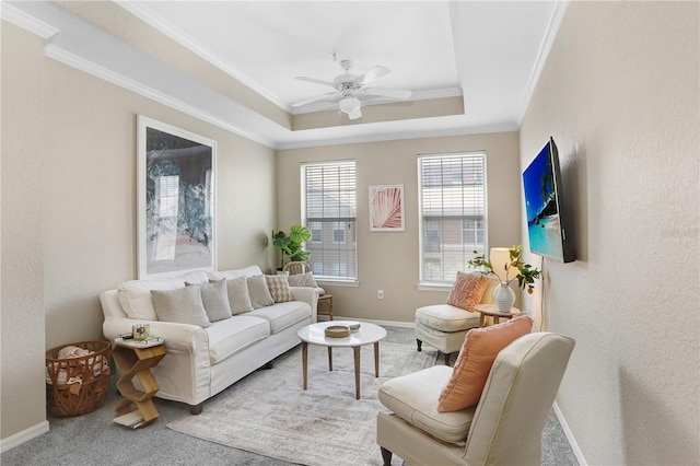 4221 W Spruce St Unit 1429, Tampa, FL 33607 - living area with ornamental molding, ceiling fan, carpet, baseboards, and a tray ceiling