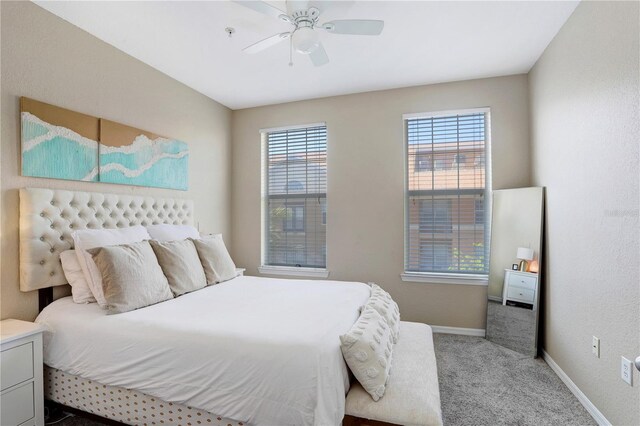 4221 W Spruce St Unit 1429, Tampa, FL 33607 - bedroom with carpet floors, baseboards, and ceiling fan