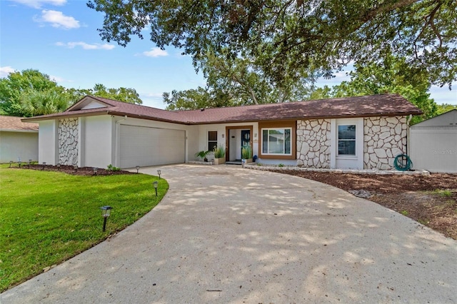2824 Paddock Dr, Palm Harbor, FL 34684 - ranch-style house with stone siding, an attached garage, a front yard, and driveway