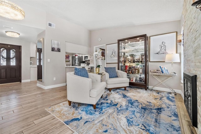 2824 Paddock Dr, Palm Harbor, FL 34684 - living area featuring wood finished floors, baseboards, and high vaulted ceiling