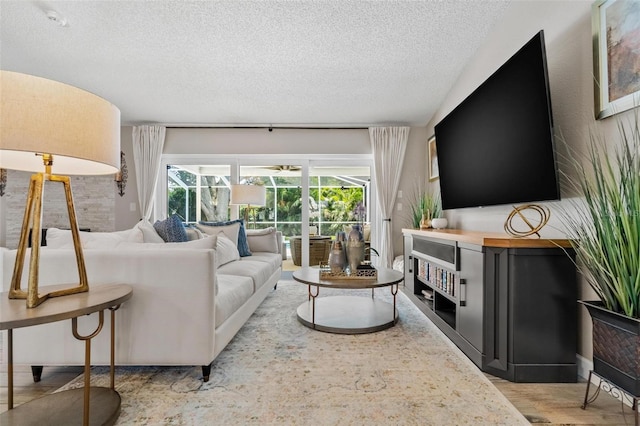 2824 Paddock Dr, Palm Harbor, FL 34684 - living room featuring a textured ceiling and wood finished floors
